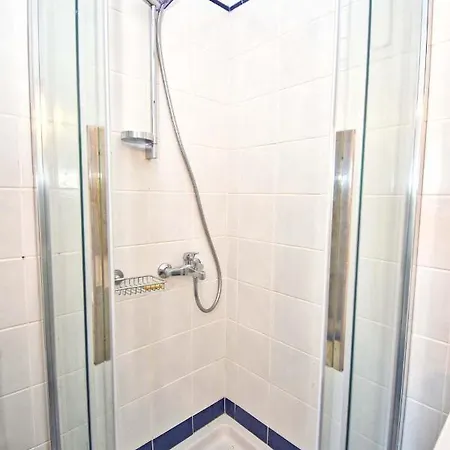 Pebbles And Sea At With Shared Pool